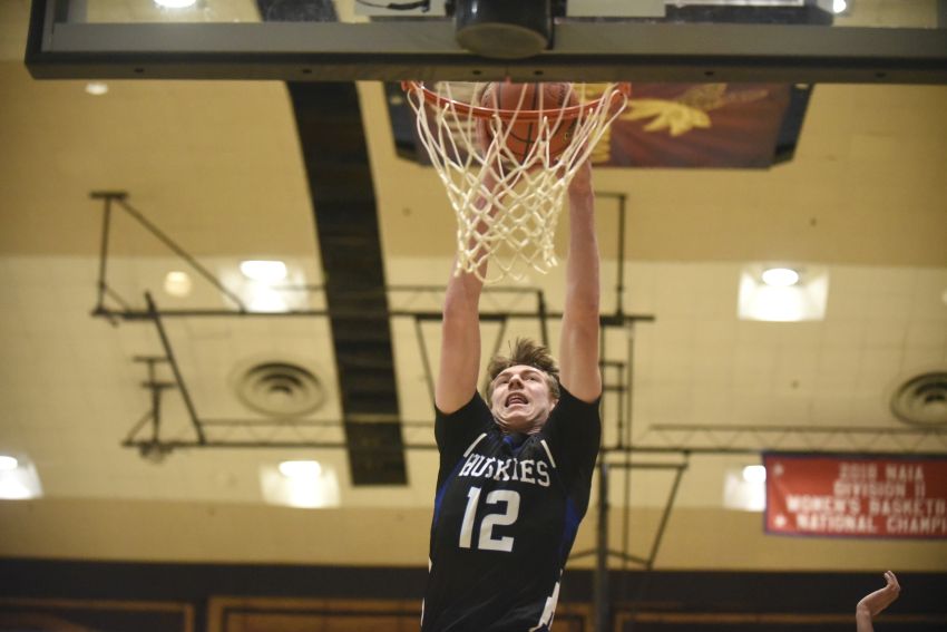 Ben Weber rising above the rim for the Bridgewater-Emery Huskies