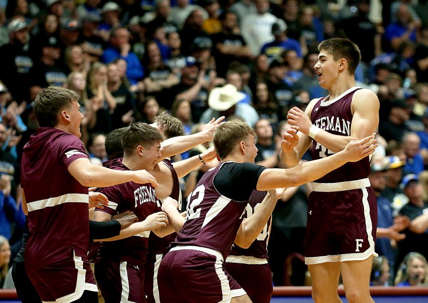 Freeman joins elite company with basketball, football championships