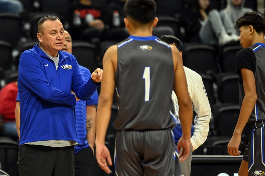 Rich Crow Eagle coaching both Tiospa Zina boys and girls basketball teams at Lakota Nation Invitational 